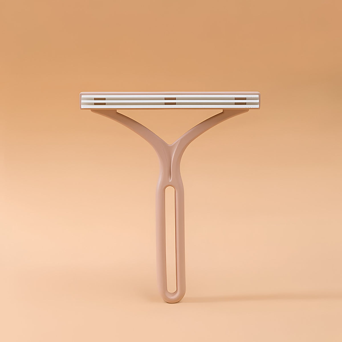 Brosse ramasse-poils en plastique rose