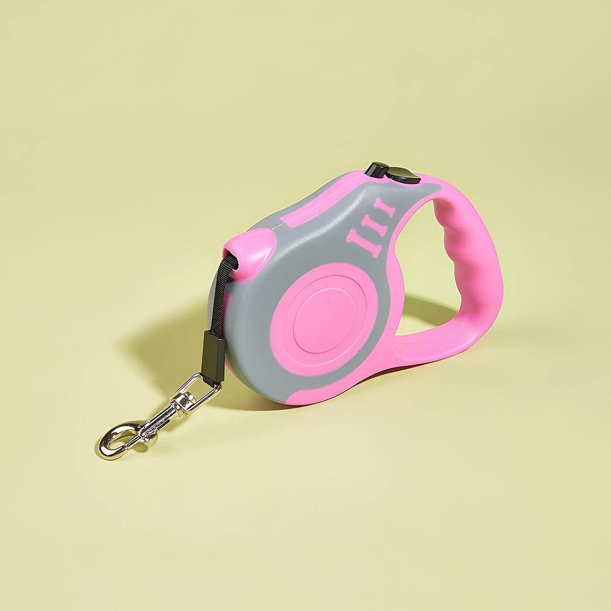 Laisse à enrouleur rose et grise